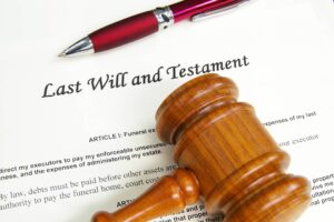 Preparing for the future: a last will and testament document with a pen and a judge's gavel, symbolizing the legal considerations of estate planning under Attorney Theodosia’s Karralla guidance in real estate law